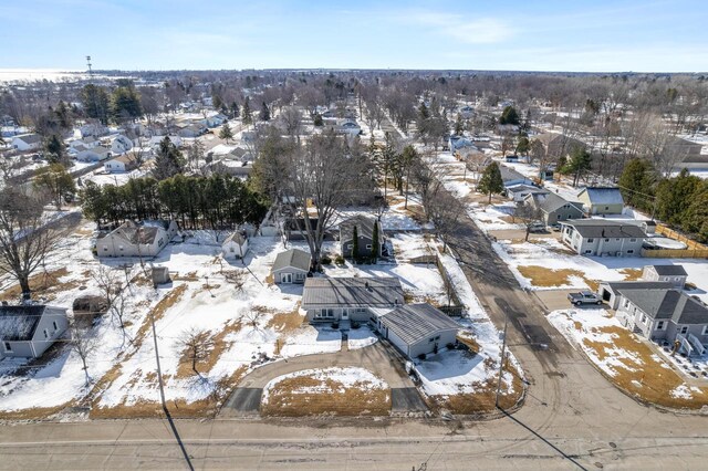 snowy aerial view featuring a residential view