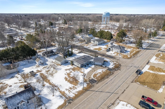 snowy aerial view with a residential view