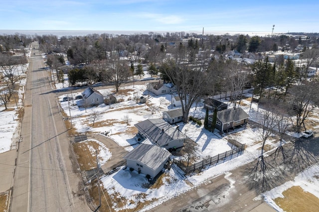 snowy aerial view featuring a residential view