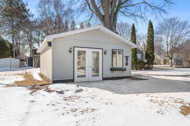 exterior space with french doors and an outbuilding