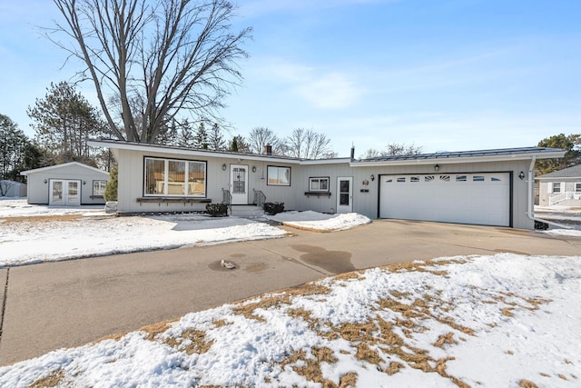 view of front of home featuring a garage and concrete driveway