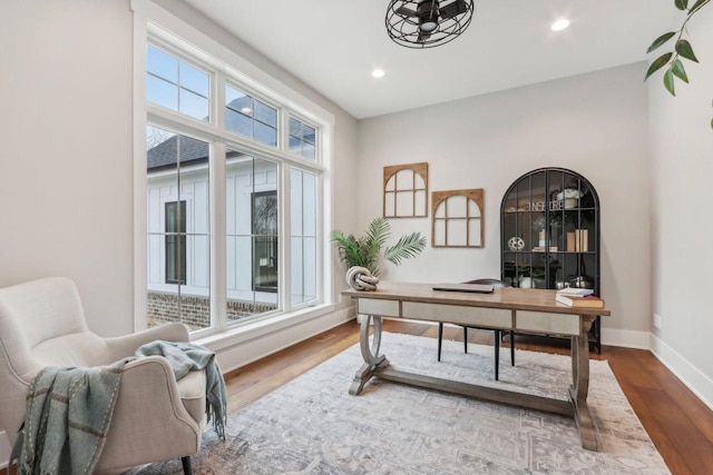 home office featuring recessed lighting, baseboards, plenty of natural light, and wood finished floors