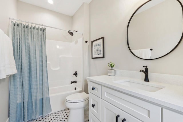 bathroom with vanity, toilet, and shower / tub combo with curtain