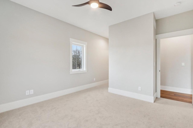 unfurnished bedroom with carpet flooring, ceiling fan, and baseboards