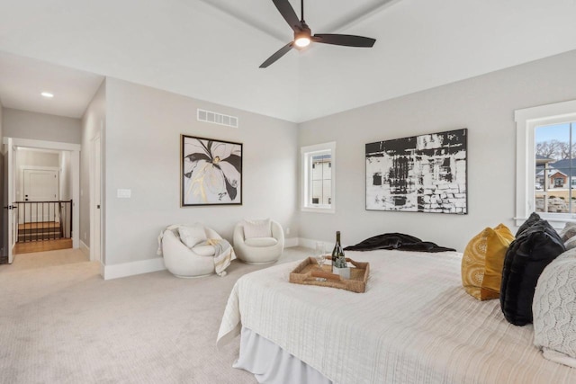 carpeted bedroom featuring visible vents, baseboards, and a ceiling fan