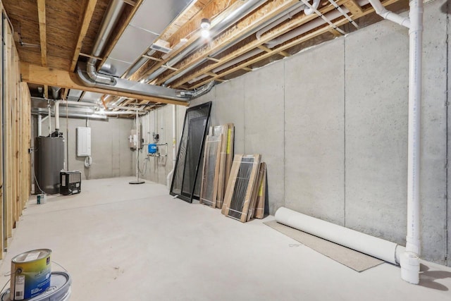 unfinished basement featuring water heater