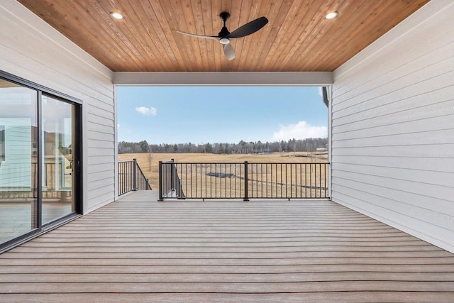 wooden deck featuring ceiling fan