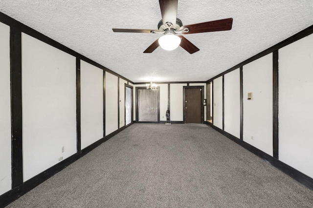 unfurnished bedroom with two closets, baseboards, carpet flooring, ceiling fan with notable chandelier, and a textured ceiling