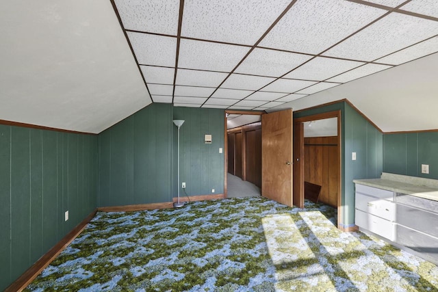 bonus room featuring vaulted ceiling and carpet floors