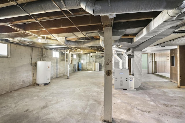 basement with heating unit and water heater