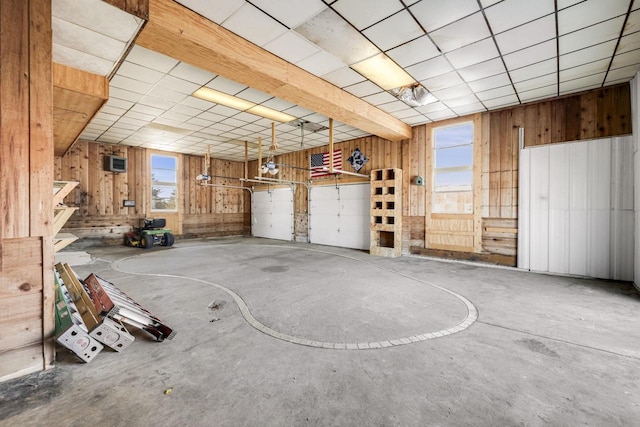 garage featuring wooden walls