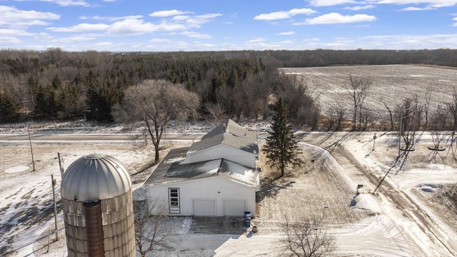 birds eye view of property with a view of trees