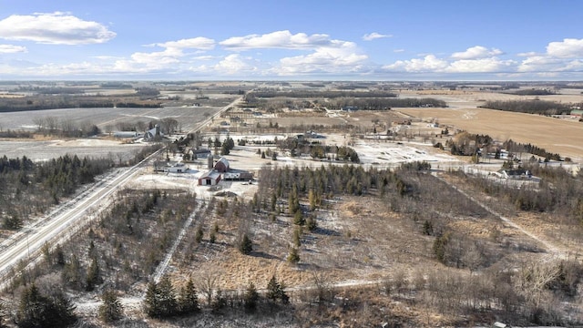 birds eye view of property featuring a rural view