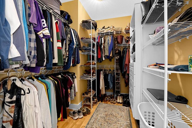 spacious closet with wood finished floors