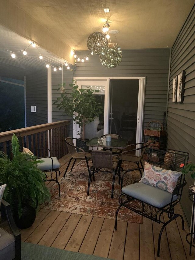 wooden terrace featuring outdoor dining space