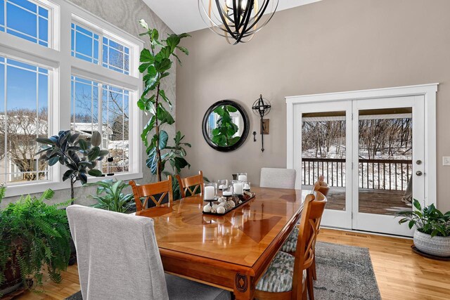 dining room featuring wood finished floors and a chandelier