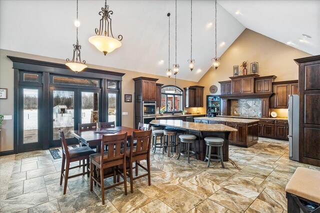 9073 Richfield Dr, Marshfield, WI 54449 - dining space featuring french doors and high vaulted ceiling