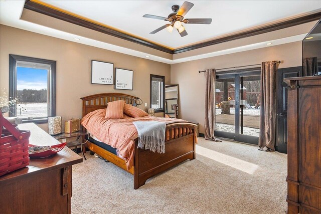 9073 Richfield Dr, Marshfield, WI 54449 - bedroom with a tray ceiling, ceiling fan, ornamental molding, light carpet, and access to outside
