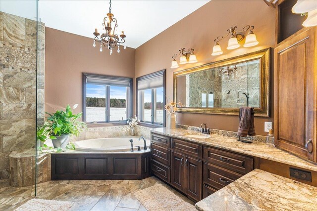 9073 Richfield Dr, Marshfield, WI 54449 - full bath with vanity, a garden tub, an inviting chandelier, and walk in shower