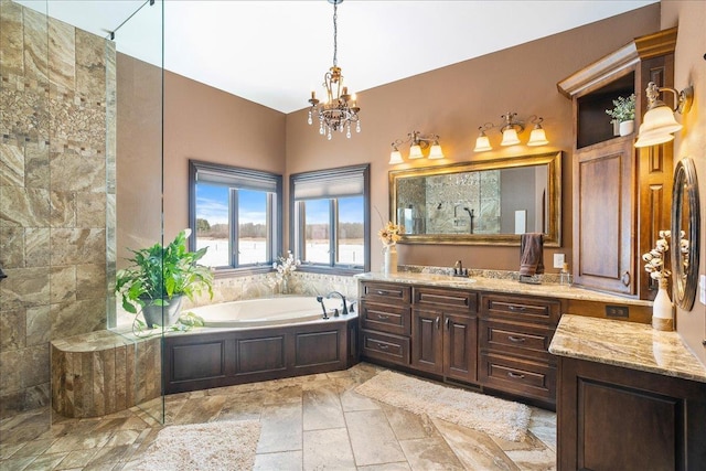 9073 Richfield Dr, Marshfield, WI 54449 - full bath with a tile shower, a chandelier, a bath, and vanity