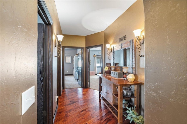 9073 Richfield Dr, Marshfield, WI 54449 - hallway with wood finished floors, baseboards, and a textured wall