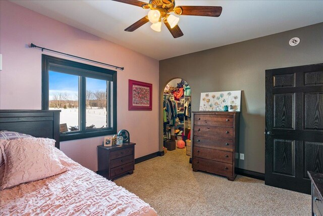 9073 Richfield Dr, Marshfield, WI 54449 - bedroom featuring a ceiling fan, baseboards, a spacious closet, a closet, and light colored carpet
