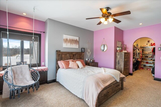 9073 Richfield Dr, Marshfield, WI 54449 - bedroom featuring recessed lighting, a walk in closet, light carpet, and ceiling fan