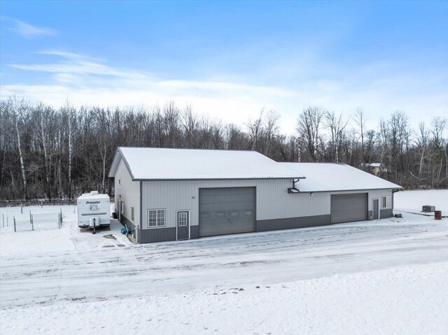 9073 Richfield Dr, Marshfield, WI 54449 - snow covered garage with a garage