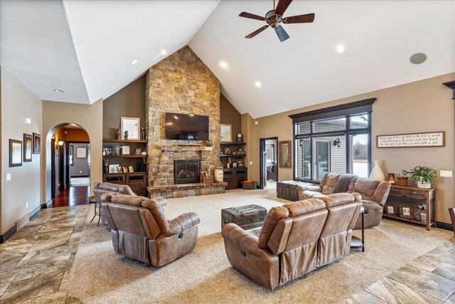 9073 Richfield Dr, Marshfield, WI 54449 - living area featuring high vaulted ceiling, arched walkways, a fireplace, baseboards, and ceiling fan