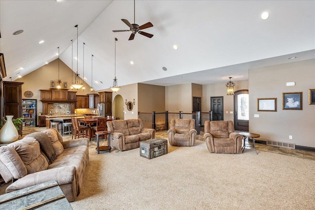 9073 Richfield Dr, Marshfield, WI 54449 - living room with visible vents, high vaulted ceiling, arched walkways, carpet flooring, and ceiling fan