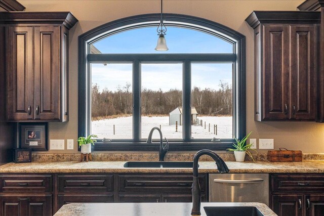 9073 Richfield Dr, Marshfield, WI 54449 - kitchen featuring dark brown cabinetry, plenty of natural light, and light countertops