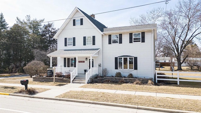 view of front of home featuring a porch and fence