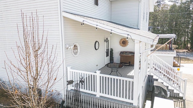 exterior space featuring a wooden deck, grilling area, and stairs