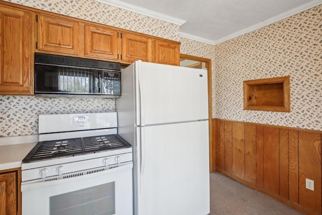 kitchen featuring brown cabinetry, white appliances, crown molding, and wallpapered walls