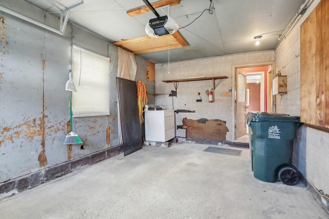 garage featuring washer / clothes dryer and a garage door opener