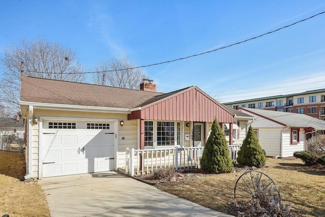 ranch-style house featuring a shingled roof, a porch, a chimney, driveway, and an attached garage