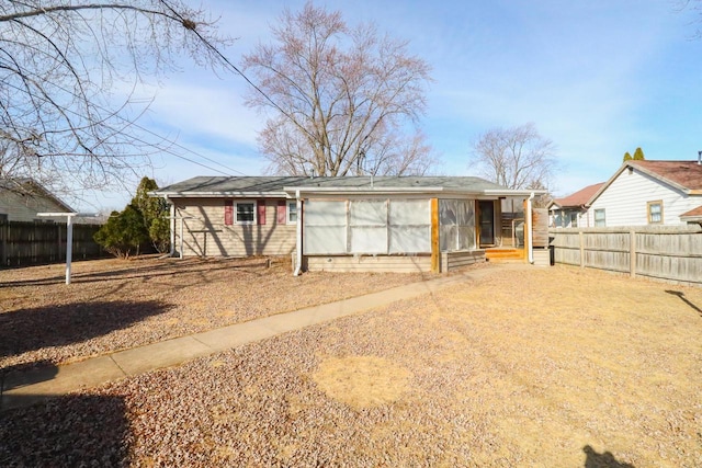 view of front of house featuring fence private yard and driveway