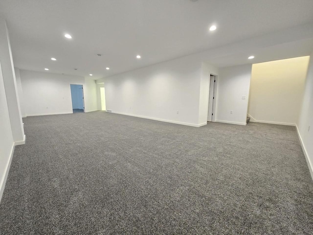 unfurnished room with recessed lighting, carpet, and baseboards