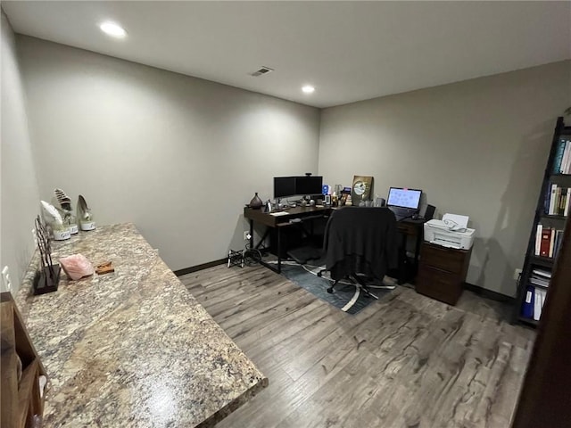 home office with visible vents, recessed lighting, baseboards, and wood finished floors