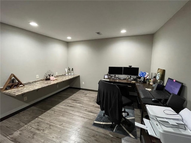 home office featuring recessed lighting, visible vents, baseboards, and wood finished floors