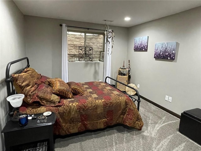 bedroom with visible vents, baseboards, and carpet floors