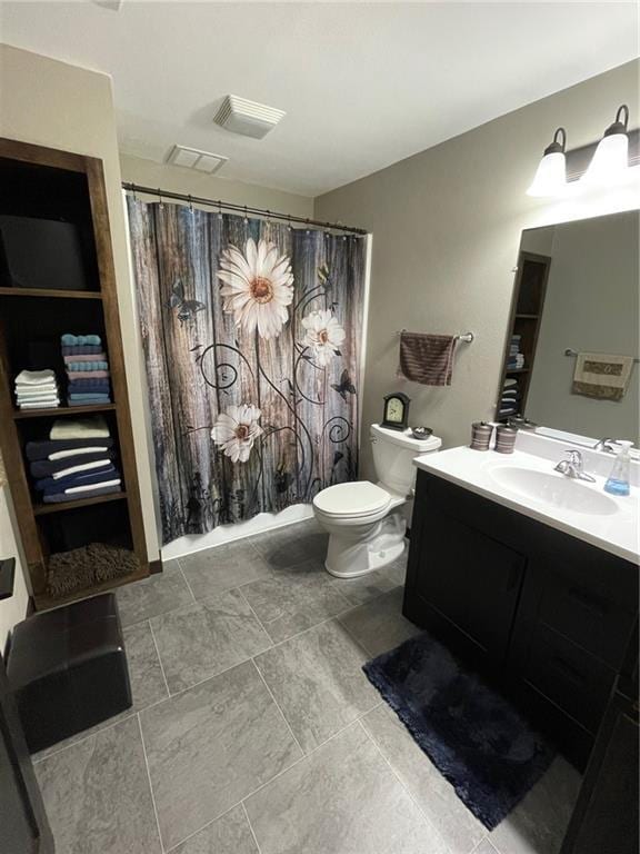 bathroom with toilet, curtained shower, and vanity