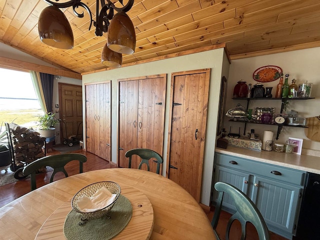 dining space with wood finished floors, wooden ceiling, and vaulted ceiling