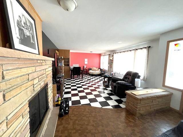 living room featuring tile patterned floors and a fireplace