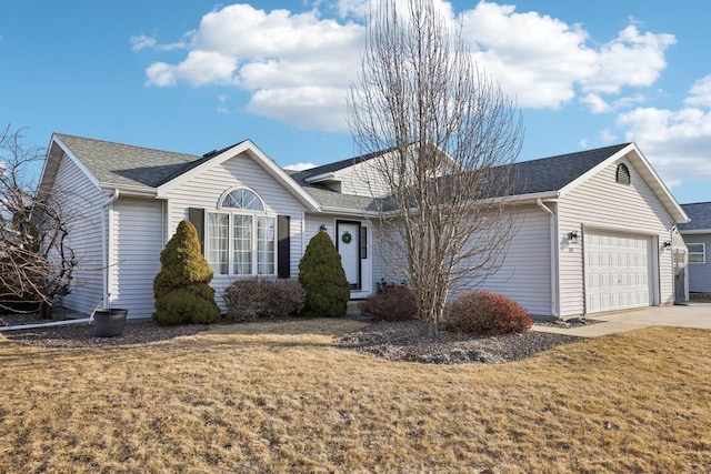 ranch-style home with concrete driveway, an attached garage, a front lawn, and roof with shingles