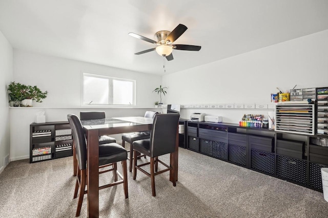 dining room with carpet floors and ceiling fan