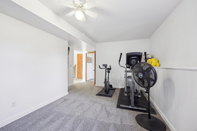 workout area with vaulted ceiling, a ceiling fan, baseboards, and carpet floors