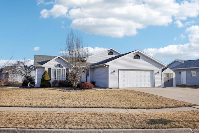 single story home with an attached garage and driveway