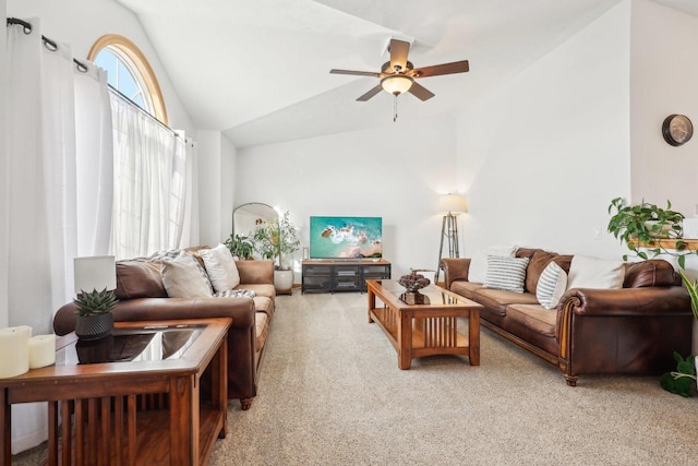 living room with vaulted ceiling, light colored carpet, and ceiling fan