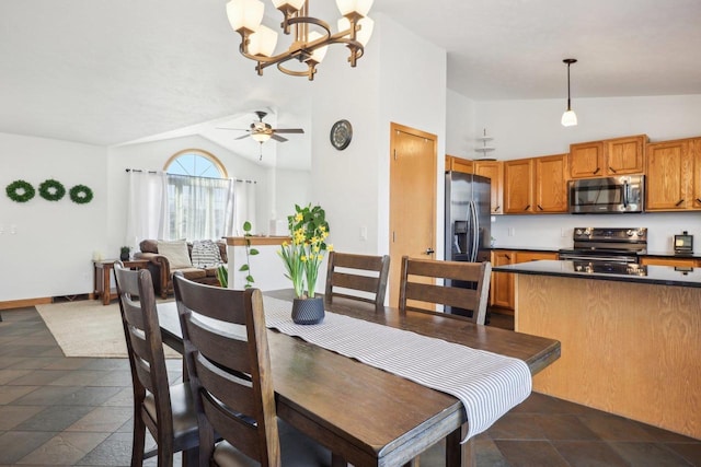 dining area featuring ceiling fan with notable chandelier, baseboards, and lofted ceiling